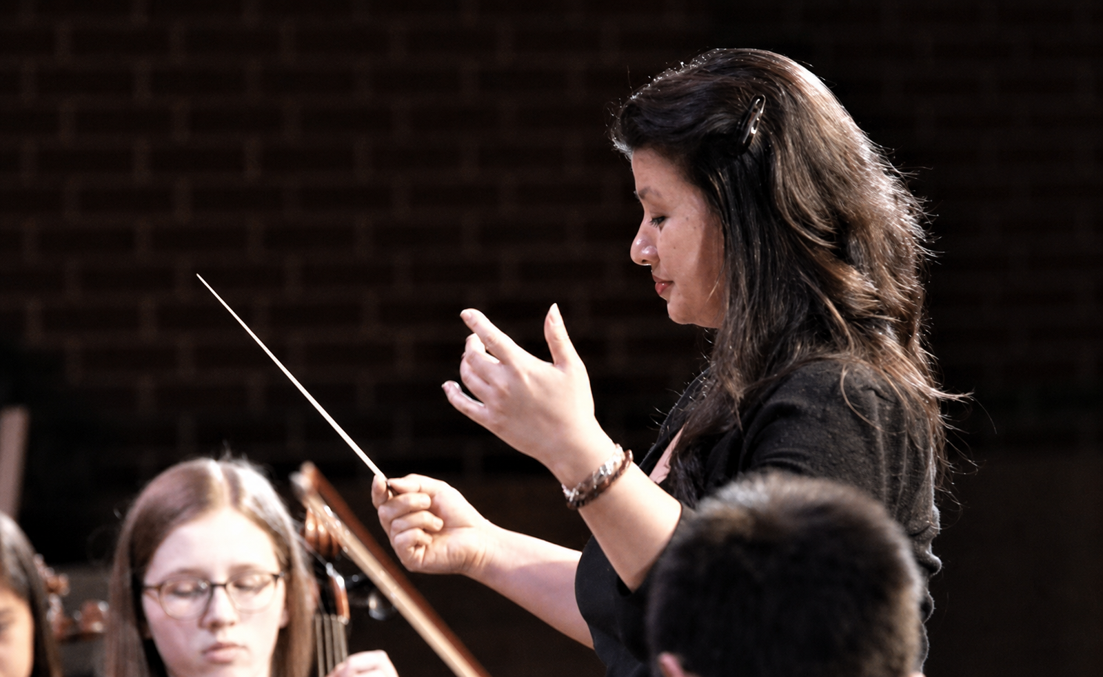 Desiree Overree conducting an orchestra